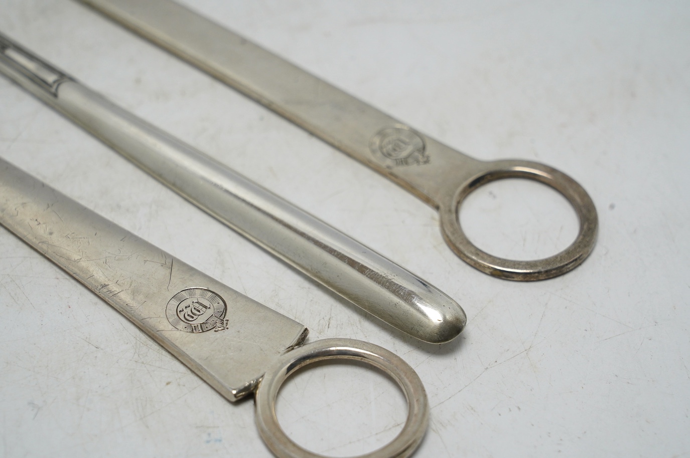 Two George III silver meat skewers by John Lias, London, 1800 and 1801, 29.9cm, together with an Edwardian silver marrow scoop. Condition - fair